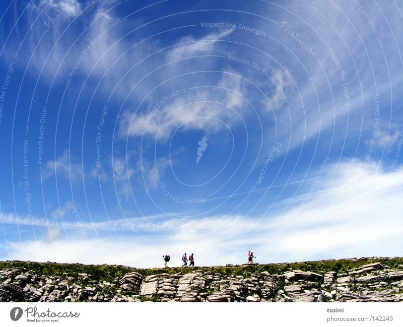 small people, big nature [3/5] Sky Mountain Human being Vantage point Far-off places Stone Rock Grass Nature Hiking Group Small Large Clouds Backpack