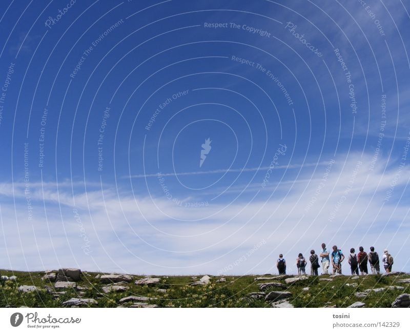 small people, big nature [5/5] Sky Mountain Human being Vantage point Far-off places Stone Rock Grass Nature Hiking Group Small Large Clouds Backpack