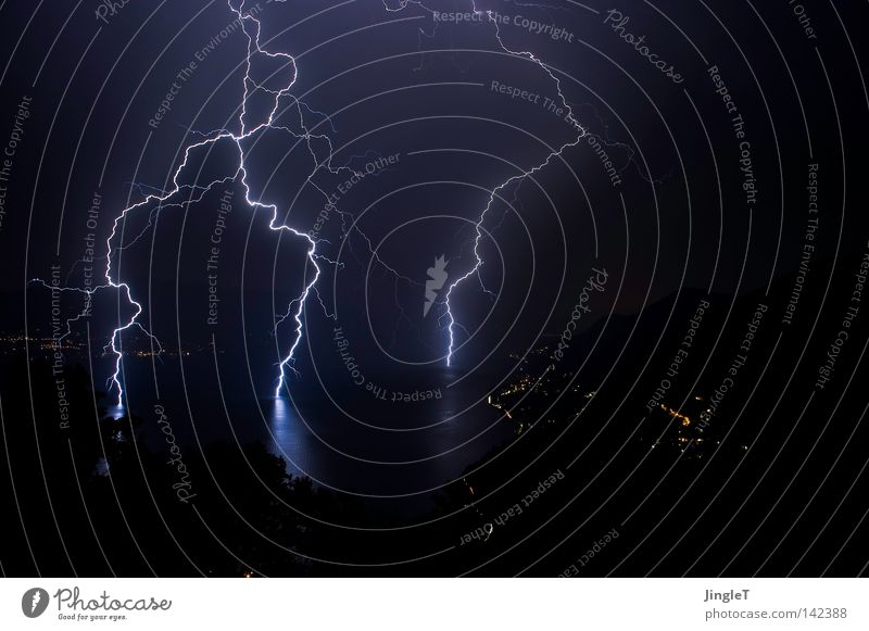 conductors Night Dark Dreary Bad weather Clouds Unload Lake Tree Mountain village Village Lightning Caught by a speed camera Crash Loud Force of nature Smash