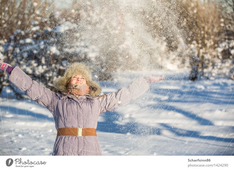 Girl enjoys the snow in winter park. Lifestyle Joy Leisure and hobbies Tourism Winter Snow Winter vacation Mountain Feminine Woman Adults Body 1 Human being