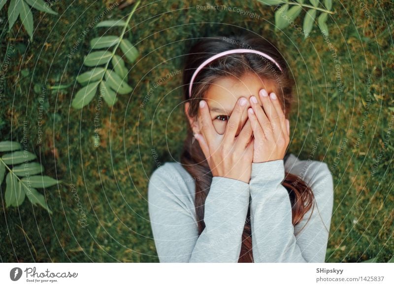 Little girl lying on the grass Summer Child Girl Hair and hairstyles Face Eyes 1 Human being 8 - 13 years Infancy Grass Smiling Laughter Success Happiness Happy