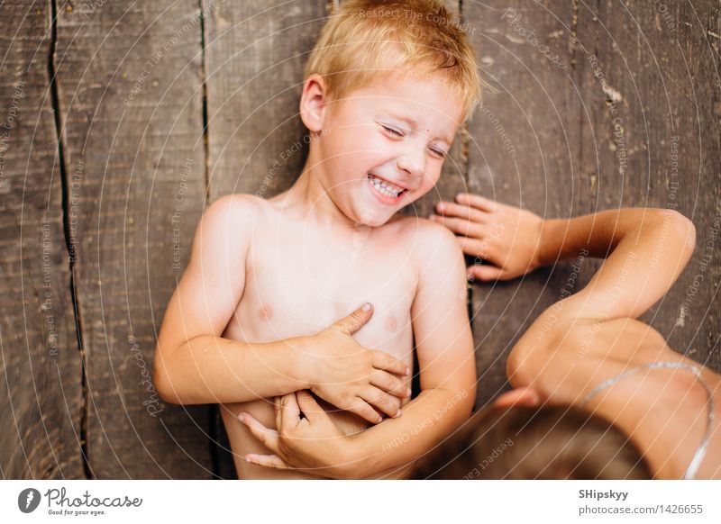 Two boys playing on the ground Human being Child Boy (child) Brothers and sisters Friendship Partner Youth (Young adults) Life Body Hair and hairstyles Face