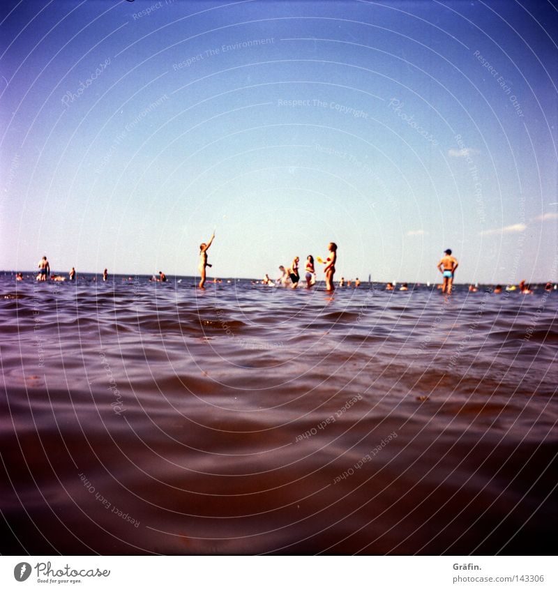 summer resort Beach Horizon Playing Flat Steinhuder Lake Interior lake Wet Cold Waves Mud Marsh Far-off places Bather Child Summer Medium format Lomography