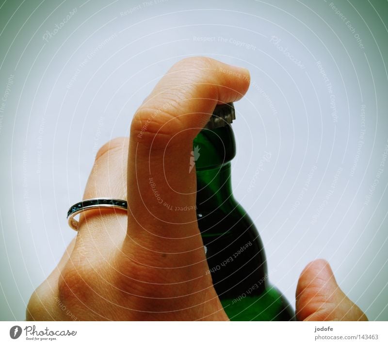 confiscated. Hand Fingers Bottle of beer Ring To hold on Closed Bottle lid Forefinger Thumb Human being Green Glass Alcoholic drinks Consumption