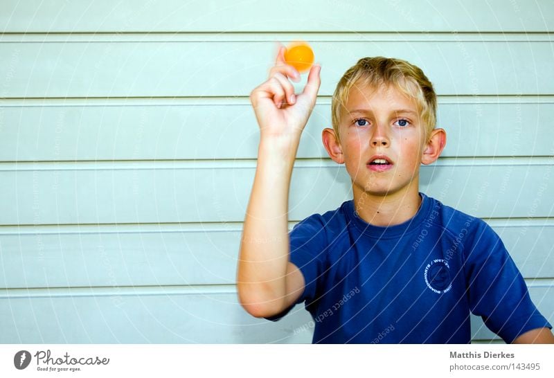 litter Table tennis Table tennis ball Motion blur Background picture Furrow Small Blonde Caught by a speed camera Practice Ball sports Playing Child Throw slam