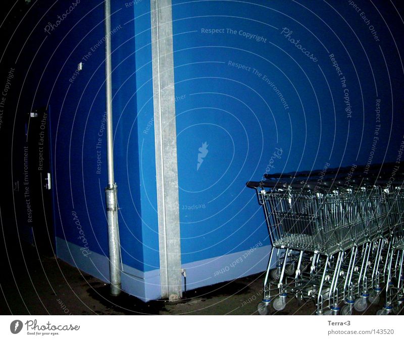 Blue. Store premises Wall (building) Dark Dirty Shopping Trolley Roll Push Shopping basket Slit Night 3 Metal Metalware Iron-pipe Door Safety Closed Joy