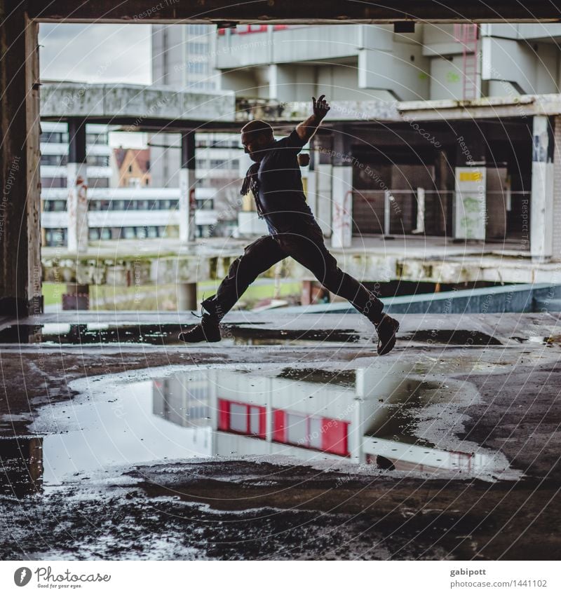 Man jumps over puddles Athletic Fitness House (Residential Structure) Human being Masculine 1 Ihme Center Hannover Ruin Building Facade Flying Walking Running