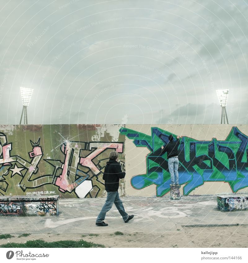 spray of light Wall (building) Wall (barrier) Prenzlauer Berg The Wall Inscription Stadium Floodlight Playing Town Shabby Man Pedestrian Human being Vandalism