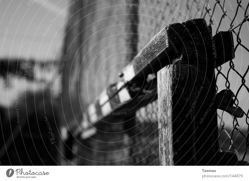 amateur football field Wood Old Decline Goal Broken Derelict Section of image Partially visible Wire netting fence Pole Goalpost corner Soccer Goal Shabby