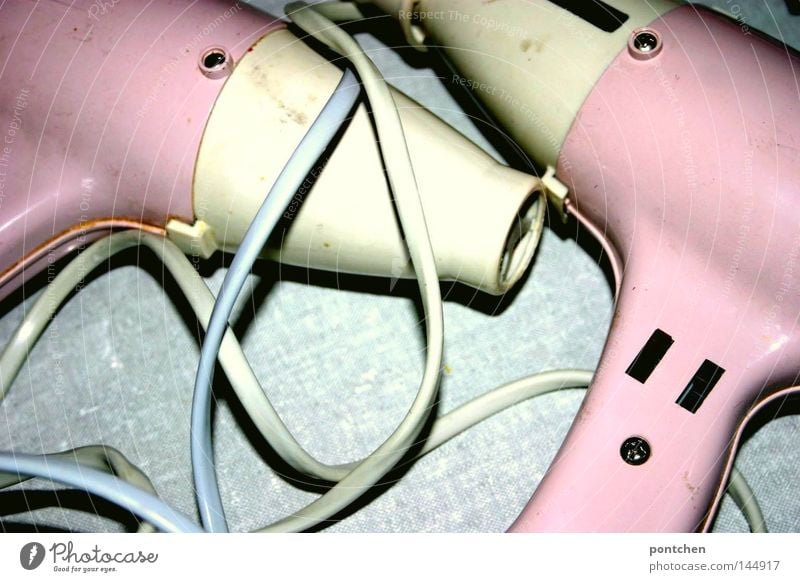 Object love. Two pink hairdryers of the same model lie on a grey background. Vintage. Twins, lovers, symbolic Hair and hairstyles Bathroom Hairdresser Cable