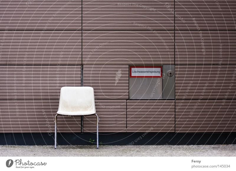 your place Chair Abstract Wall (building) Extinguisher Signage street Wall (barrier)