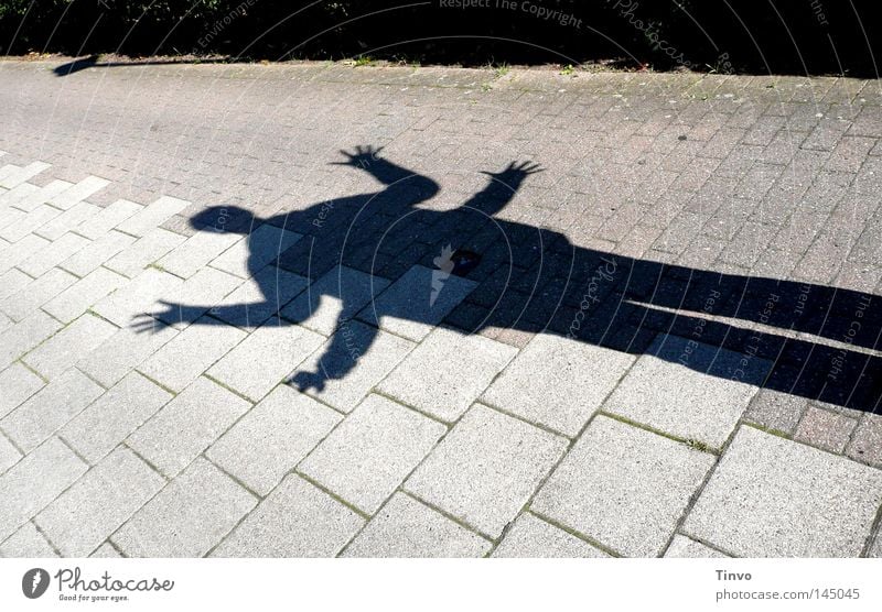 shadow play Arm Legs Concrete slab Ground Saurians Fingers Fantasy Seam Sidewalk Human being Gray Hand Behind one another Long Light Mite Shadow Black Joy