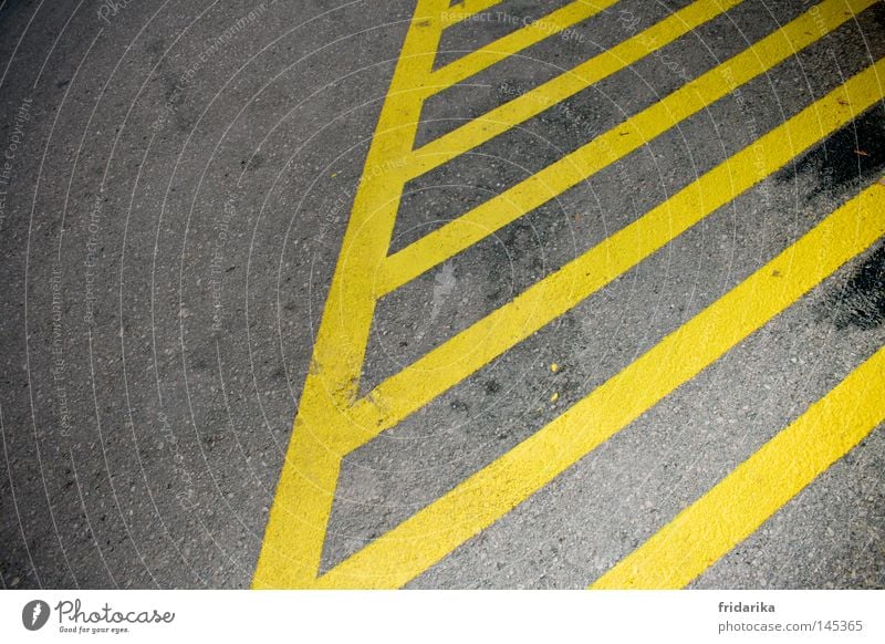 streaked Transport Traffic infrastructure Street Lanes & trails Stripe Yellow Gray Across Diagonal Stop (public transport) Colour photo Exterior shot