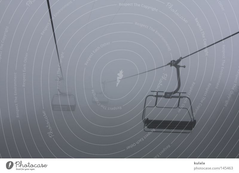 Chairlift ride in the fog Calm Trip Mountain Hiking Chair lift Nature Drops of water Sky Autumn Weather Bad weather Fog Cable car Creepy Cold Gray Dreary Damp