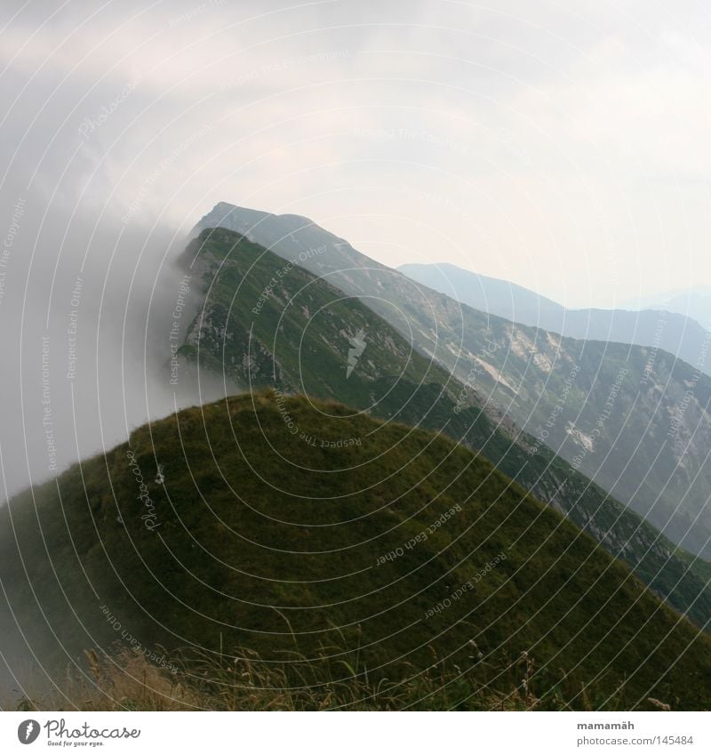 Fog of horror Colour photo Exterior shot Mountain Landscape Sky Clouds Weather Beautiful weather Bad weather Wind Grass Peak Dark Cold Fear Risk Mountain ridge