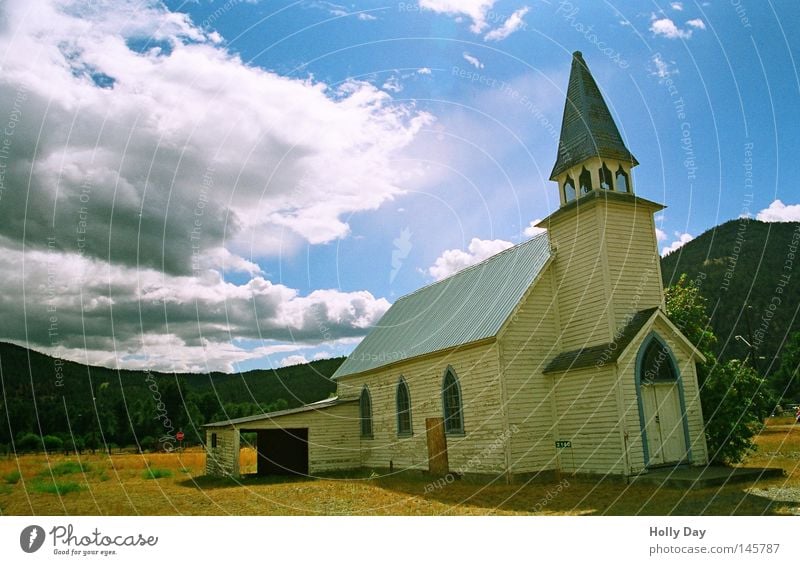 Not without a garage. Religion and faith Church House of worship Garage White Tower Church spire Bell tower Wide angle Clouds Sun Structures and shapes