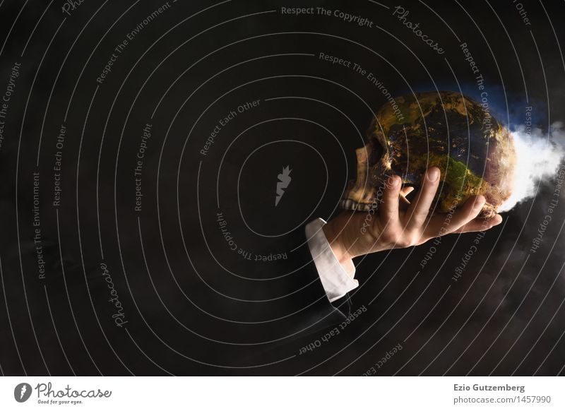 Man holding a globe in the shape of a skull in his hand Economy Stock market Business Company Human being Masculine Head Arm Hand 1 30 - 45 years Adults