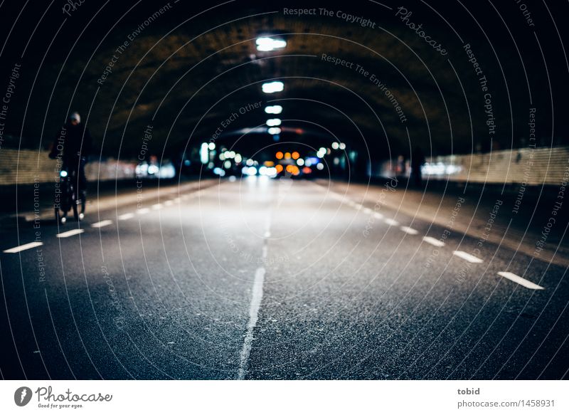 Dark lane Cycling Street Tunnel Movement Driving Cold Town Underpass Lantern Light Asphalt Colour photo Exterior shot Night Artificial light Shadow Contrast