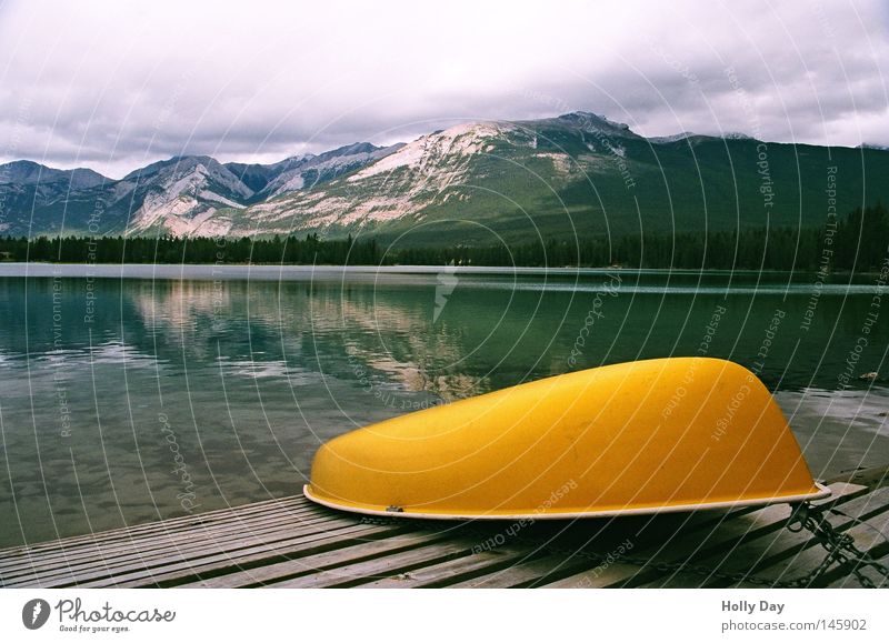 Break at Edith Lake Watercraft Mirror Smoothness Yellow Mountain Alberta Jasper National Park Footbridge Jetty Calm Reflection North America Canada Chain Clouds