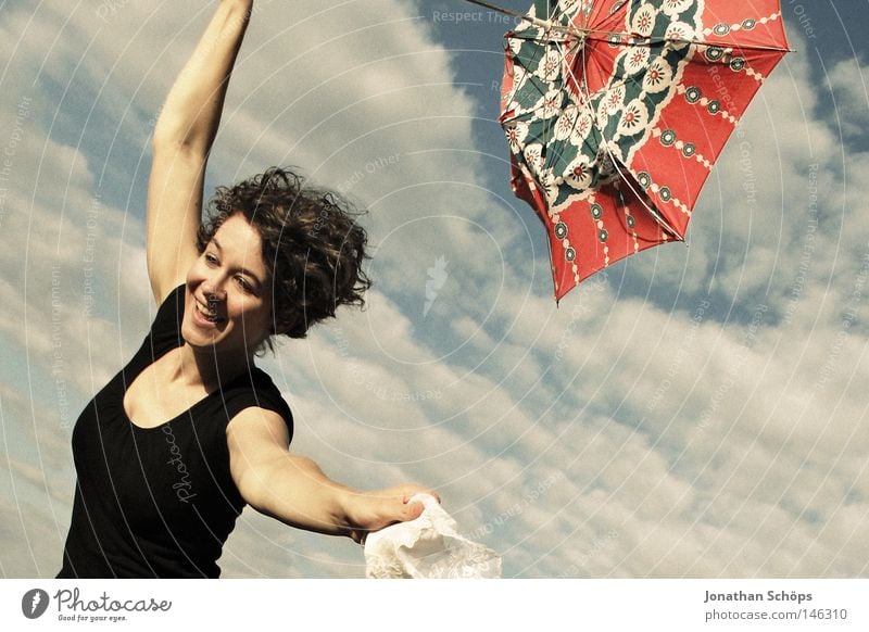 young woman with red umbrella stretches her arms in the blue sky for joy Joy luck Hair and hairstyles Contentment Far-off places Success Human being Feminine