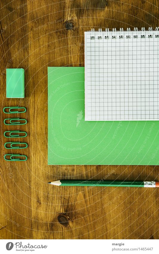 Green writing utensils, paper, slips of paper, rake - block, pencil, paper clips on a wooden desk - desk Study Work and employment Profession Office work