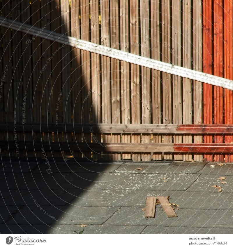 A man-made demarcation Fence Wood Wooden board Red Brown Light Colour Safety Placed Nature Shadow Floor covering Exterior shot