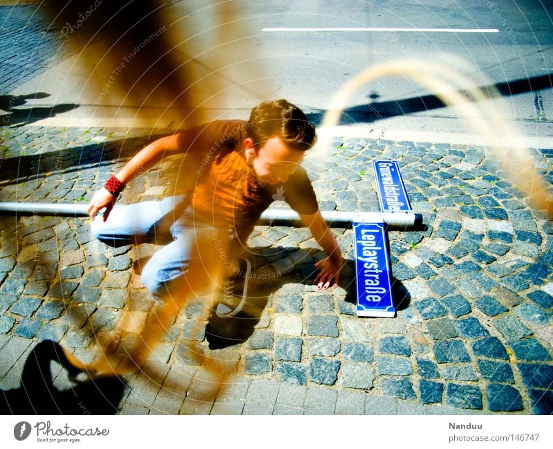 Stormy times Gale Street Signs and labeling Street sign Human being Man Youth (Young adults) Youth culture Multicoloured Strand of hair Wind Whimsical Strange