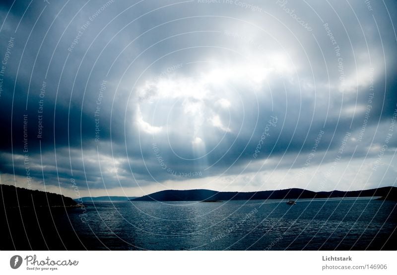 he's talking to us. Colour photo Subdued colour Exterior shot Deserted Day Twilight Light Light (Natural Phenomenon) Sunlight Sunbeam Wide angle Calm Ocean