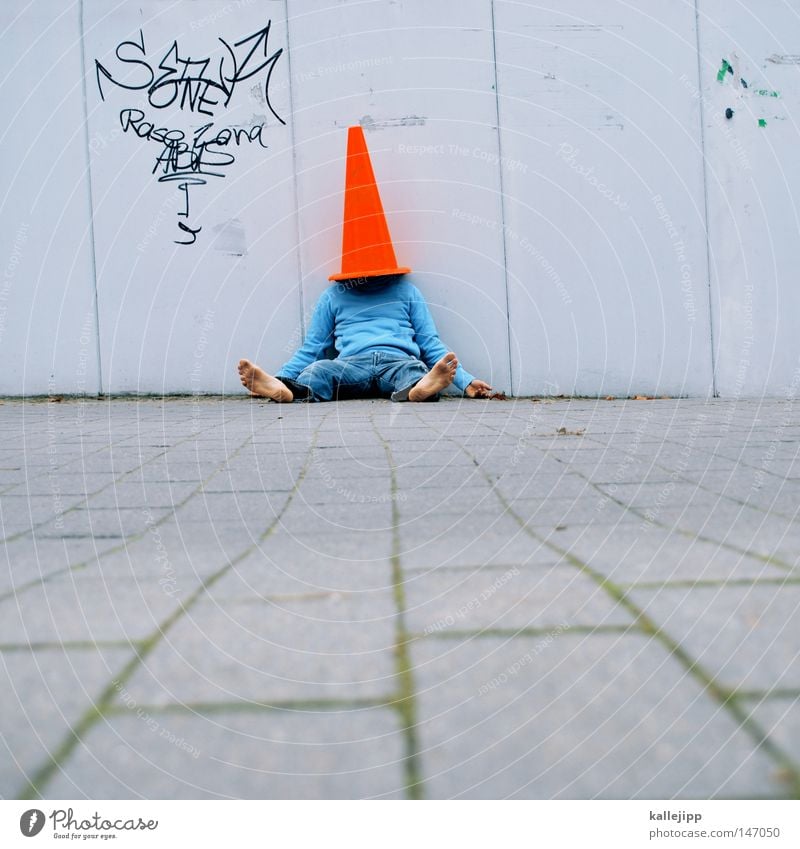 from the socks Man Human being Mushroom cap Headwear Red Construction site Hat Playing Barefoot Wall (building) Crash barrier Transport Town Whimsical Crazy