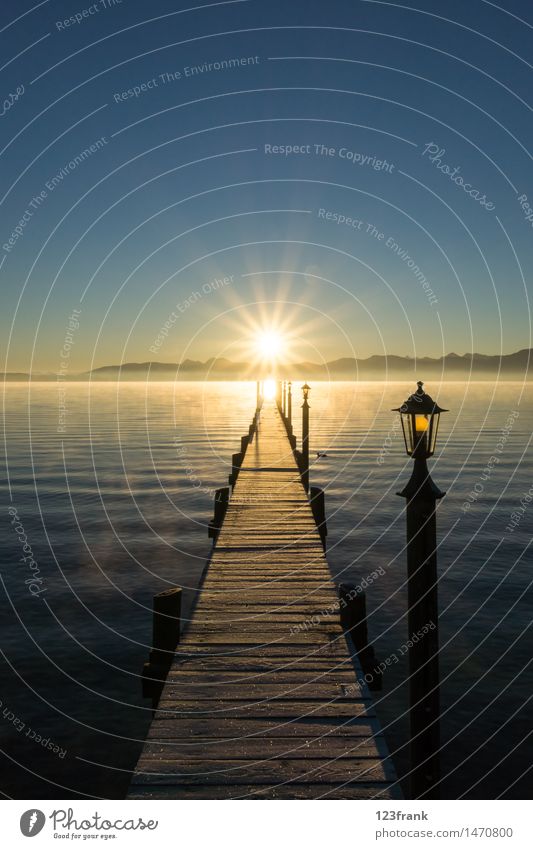 Sunrise at the long jetty Relaxation Calm Hiking Landscape Water Cloudless sky Sunset Sunlight Autumn Beautiful weather Fog Alps Mountain Lakeside Lake Chiemsee