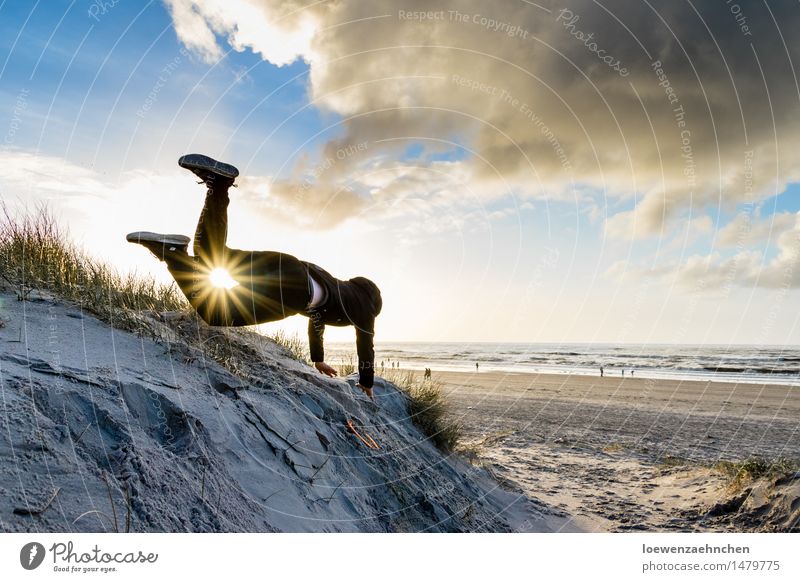 high achiever Human being Masculine Man Adults 1 Nature Water Clouds Sunlight Winter Coast Beach North Sea Ocean To fall Flying Jump Free Happy Funny Joy