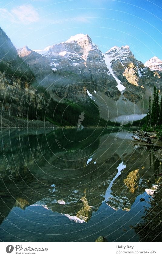 THE OTHER SIDE Mountain Lake Water Surface Smoothness Mirror Transparent Calm Peace Snow Peak Blue Beautiful weather Blue sky Clouds Alberta North America