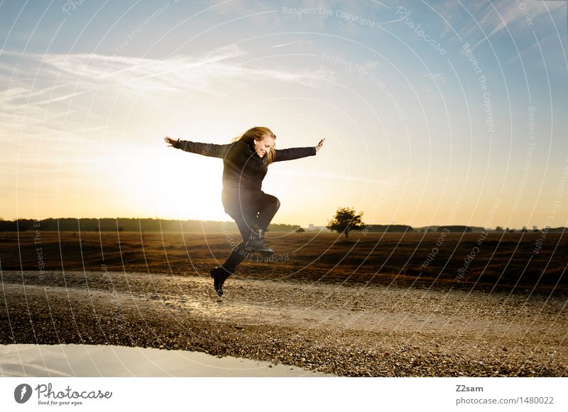 Life is beautiful Lifestyle Style Landscape Sky Sunrise Sunset Autumn Beautiful weather Heathland Fashion Coat Boots Blonde Long-haired Jump Happiness