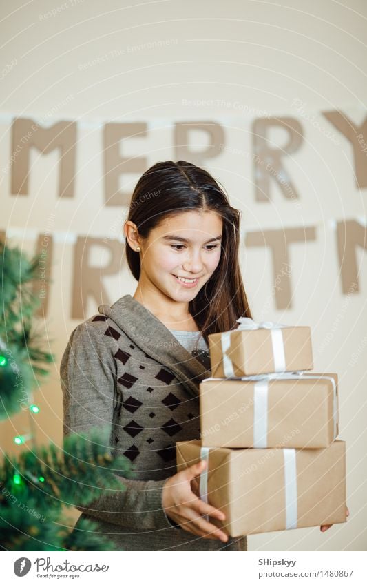 Little girl holding Christmas gifts and smile Winter Snow Lamp Christmas & Advent Birthday Child Girl Sister Friendship Hair and hairstyles Face Eyes 1