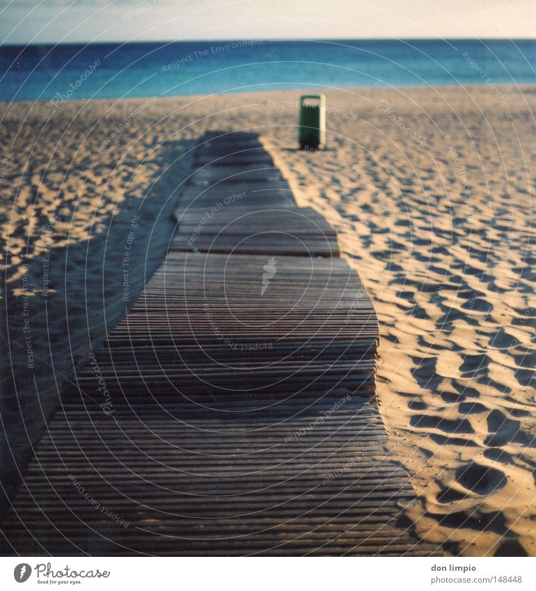 just straight ahead Beach Ocean Sand Shadow Trash container Blue Sidewalk Plank Wood Horizon Empty Footprint Physics Evening Fuerteventura Blur Medium format