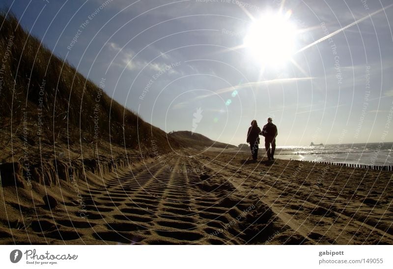 get older Colour photo Exterior shot Sunlight Sunbeam Back-light Relaxation Calm Vacation & Travel Trip Beach Ocean Hiking Human being Woman Adults Man Couple 2