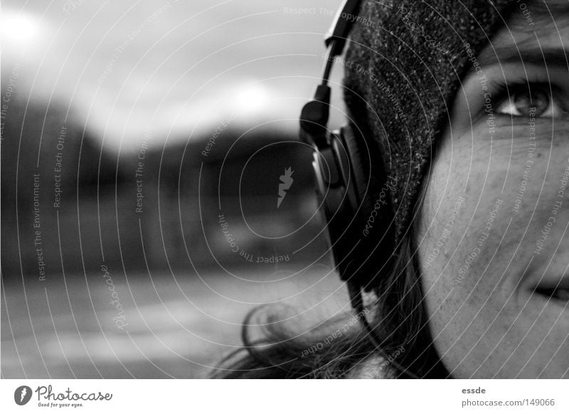 audio enjoyment Black & white photo Exterior shot Copy Space left Deep depth of field Central perspective Upward Joy Happy Relaxation Music Woman Adults