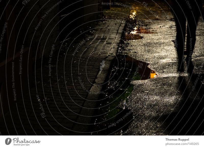 somber Street Gray Anthracite Wet Alley Narrow Loneliness Empty Dark Lanes & trails Human being Silhouette Shadow Puddle Asphalt Legs Movement Slowly Water Rain