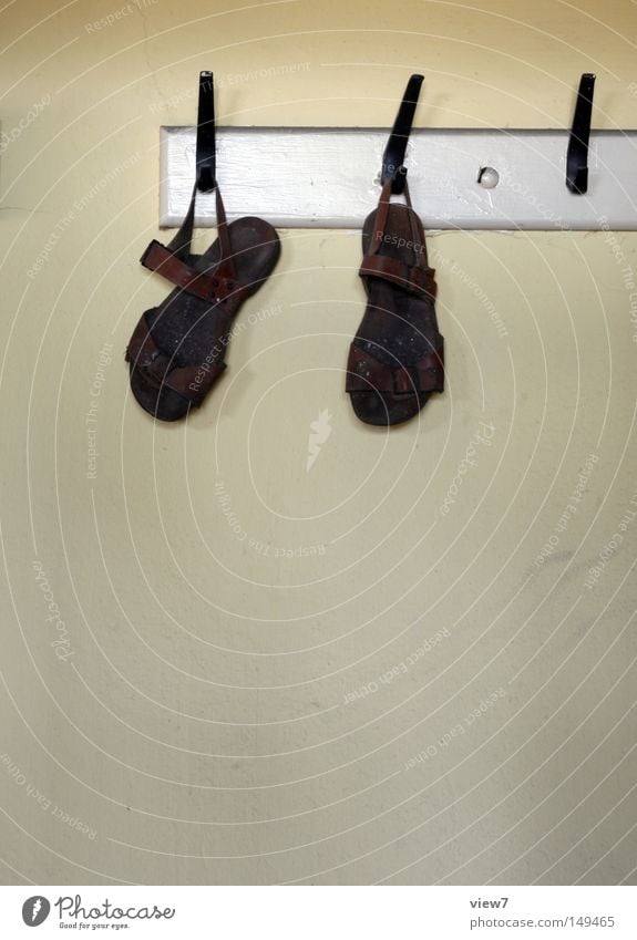 sandals Sandal Footwear Walking Occur Hang up Hanger Clothing Hallstand Hallway Detail Leather strip Buckle Shoe sole Feet Wall (building) Wallpaper Plaster