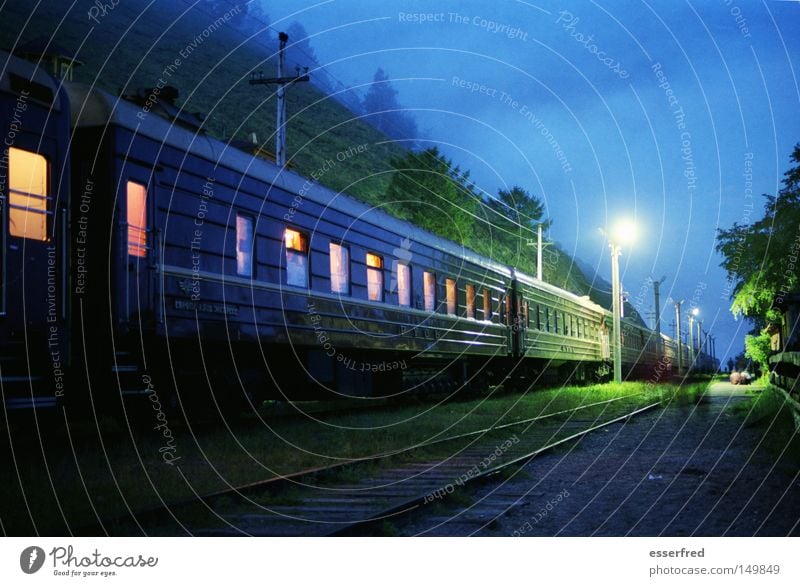 NightTrain Nostalgia Russia Railroad Means of transport Railroad car Railroad tracks Lantern Train window Lighting Evening Blue Mystic Clouds Calm