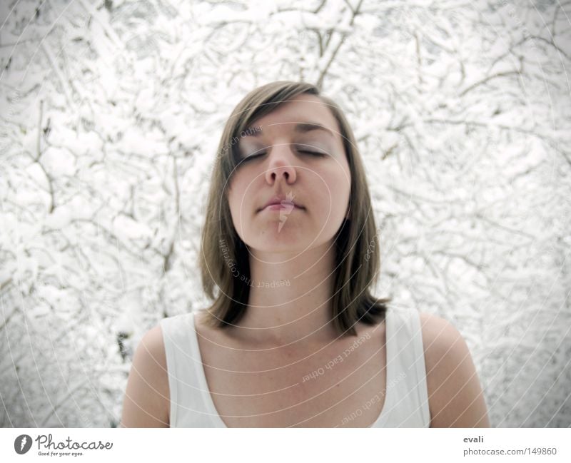 The first fall of snow is a magical event Portrait photograph Woman Closed eyes Snow Tree Branch T-shirt Cold Winter November eyes closed trees