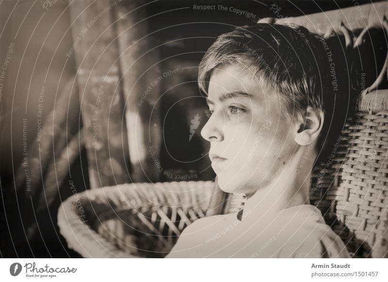 Black and white picture of a teenager in a wicker chair Lifestyle Style Design pretty Senses Relaxation Calm Attic Human being Masculine Young man