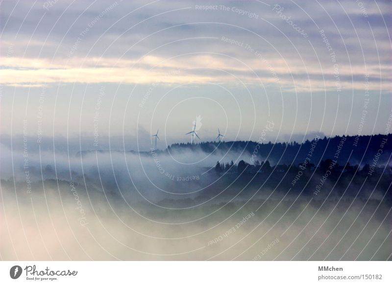 On the edge of the world Fog Fog bank Forest Village Settlement Mystic Wind energy plant Eifel Autumn Weather Vantage point Blue Gray Panorama (View) Sky Large