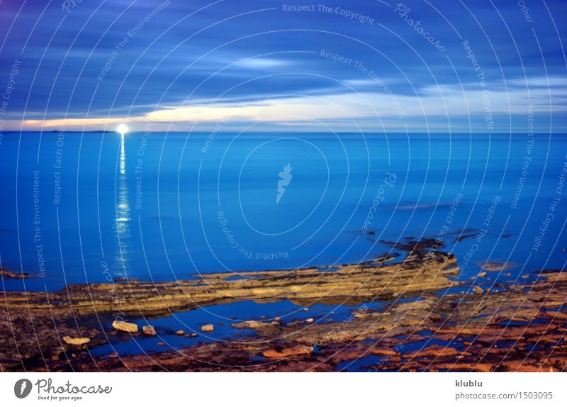 Lighthouse at dusk, in a long time exposure (England) Cruise Ocean Lamp Clouds Rock Coast Harbour Ferry Watercraft Emotions beacon direct drive Dusk Guide