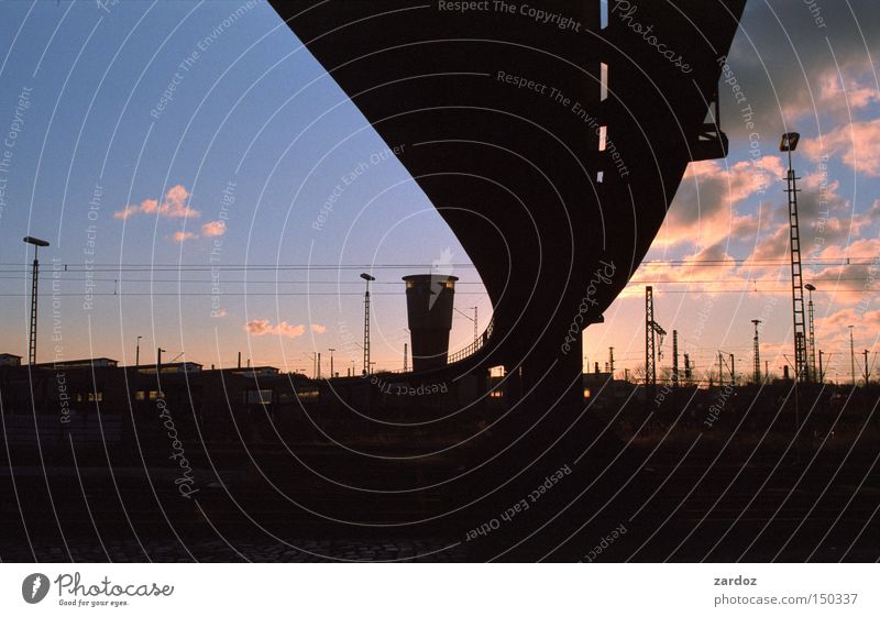 Silhouette Sky Clouds Train station Bridge Tower Architecture Transport Traffic infrastructure Rail transport Railroad Freight station Homesickness Hamburg Dusk