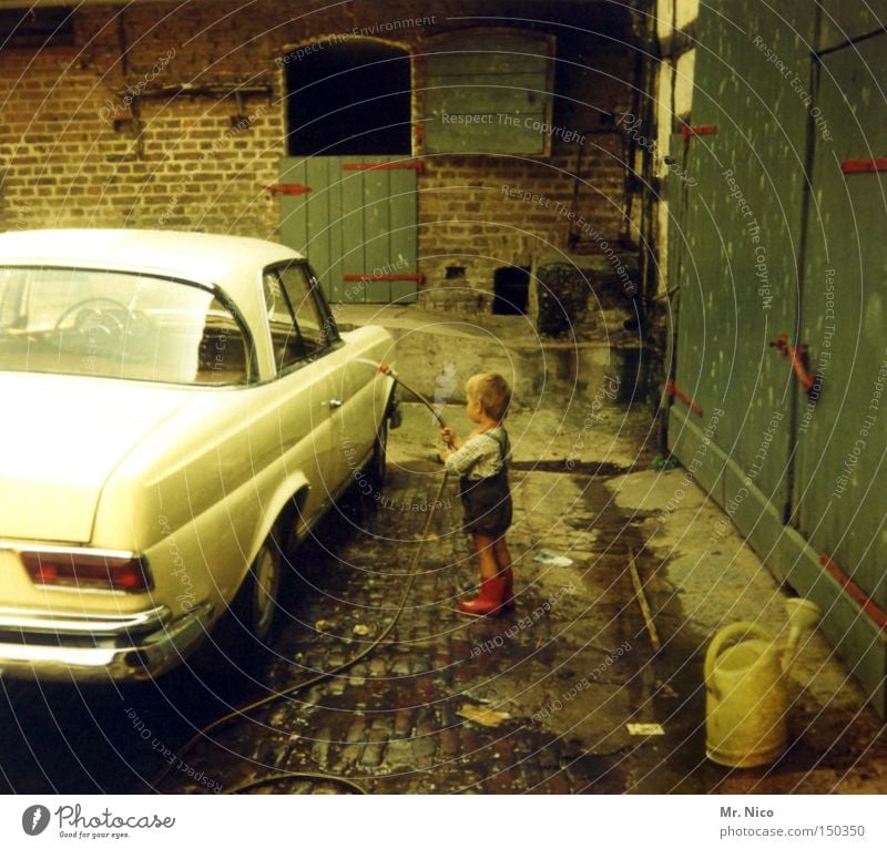 mr.wash Car wash service Vintage car Wet Rubber boots Farm Seventies Joy Motor vehicle Former Nostalgia Self portrait Toddler Water Leather shorts Child