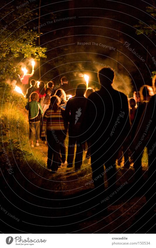 night hike Nocturnal ramble Hiking Torch Youth (Young adults) Fire Dark Forest Fear Panic Group Blaze Spooky