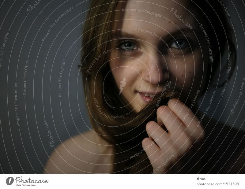 smiling woman in half light Feminine 1 Human being Brunette Long-haired Observe Communicate Smiling Looking Wait pretty Happy Happiness Contentment Passion