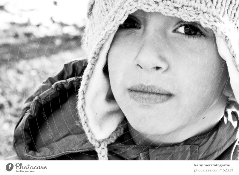 eye view Cap Winter Cold Black & white photo Face Portrait photograph Mouth Timidity Fear Child Boy (child) Snow Eyes Nose Lips