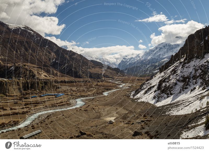 View of Valley at Manang Village on the Annapurna Circuit Vacation & Travel Tourism Adventure Mountain Hiking Nature Landscape Clouds Snowcapped peak Glacier